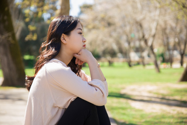 pensive-sad-asian-girl-getting-blues-spring-park_1262-18895.jpg