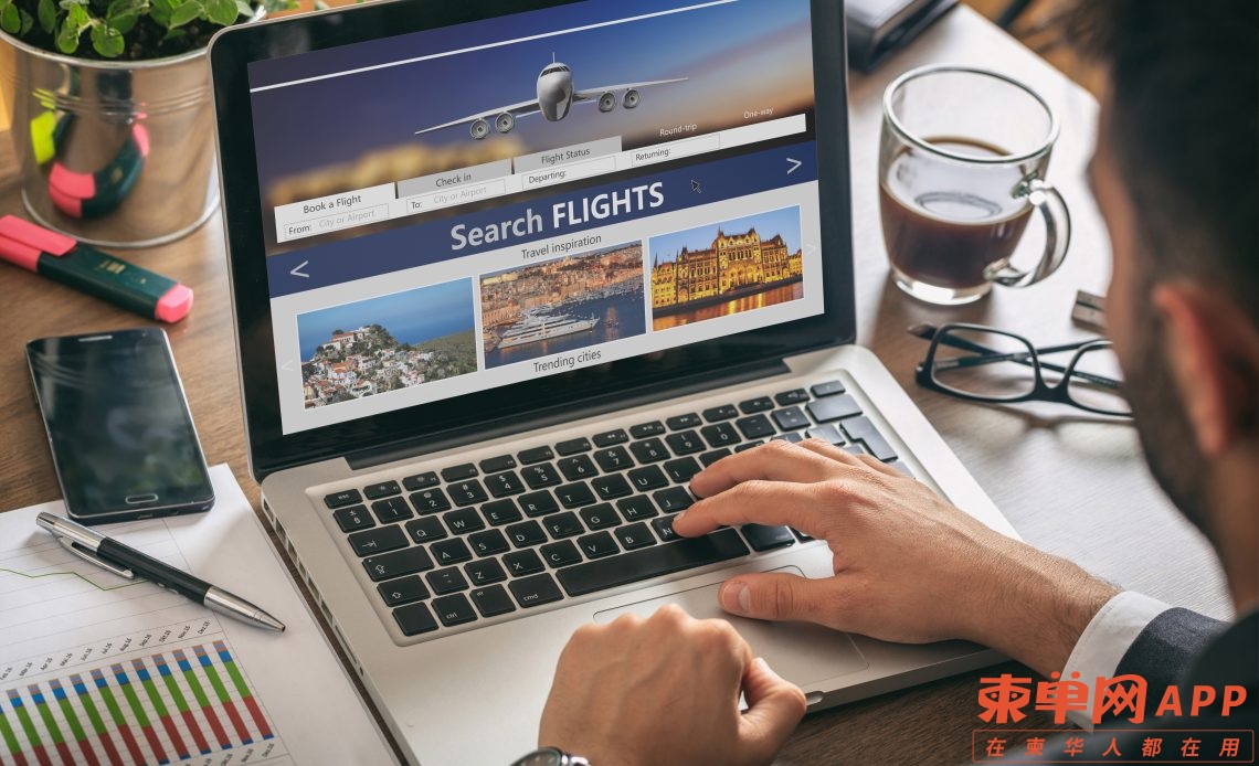 man-working-with-a-computer-search-flights-on-the-GQ8U32Z-1140x694.jpg