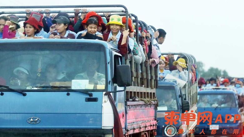 garment_workers_ride_home_along_national_road_5_after_clocking_out_of_work_in_th.jpg